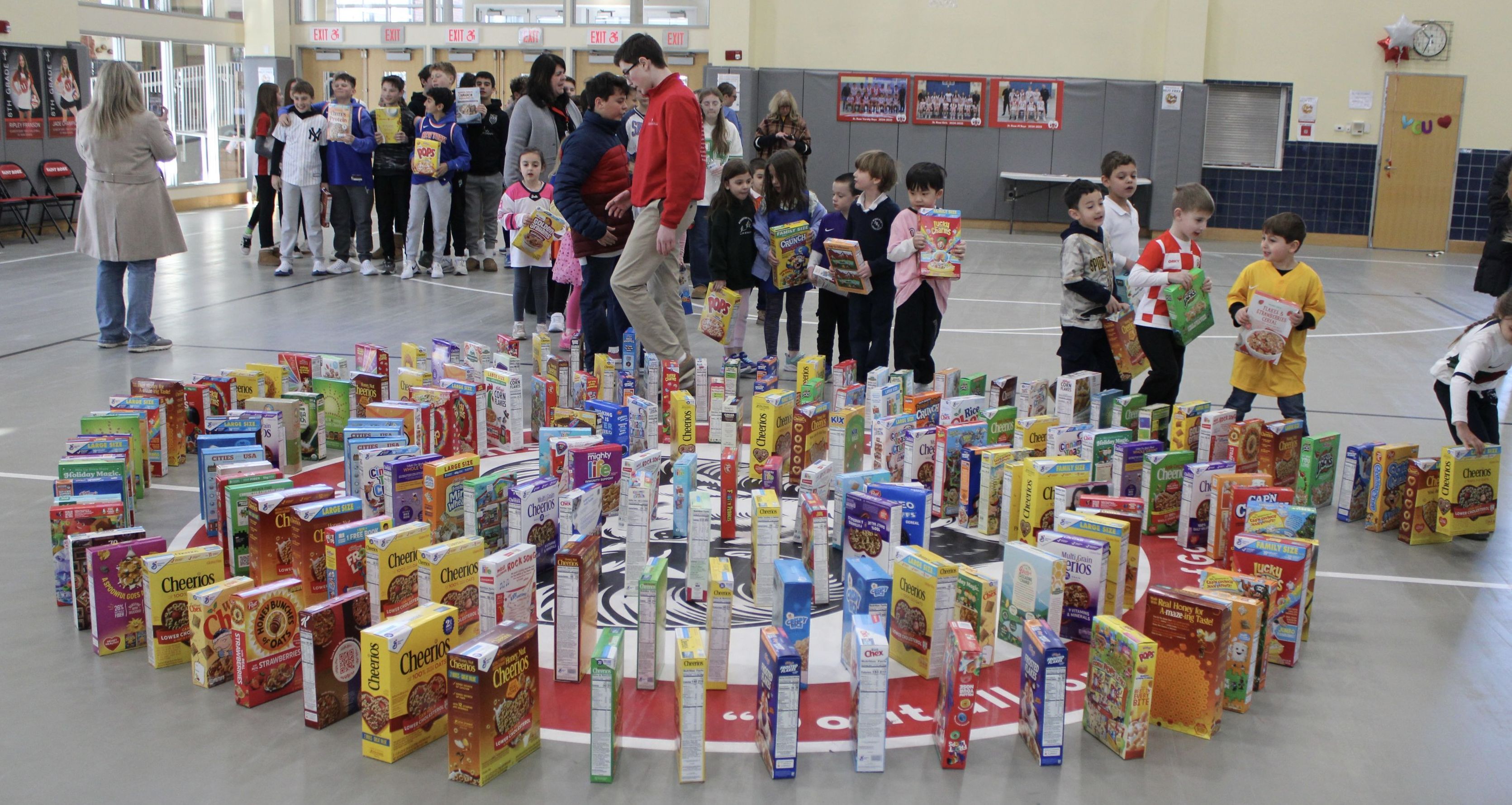 Dozens of cereal boxes are arranged like dominos in a spiral