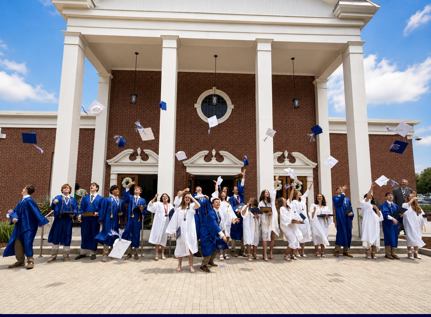 Class of 2026 STands in blue and white graduation robes, tossing their caps Class of 2026 STands in blue and white graduation robes, tossing their caps